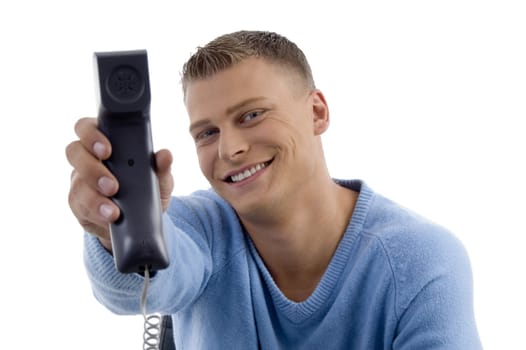 young man showing phone receiver on an isolated background