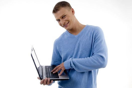 smiling young man with laptop with white background
