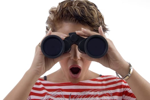 young woman looking through binocular against white background