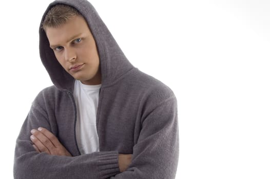 portrait of young handsome man with crossed arms on an isolated background