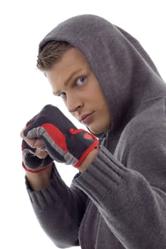 sportive guy showing exercise gloves on an isolated background