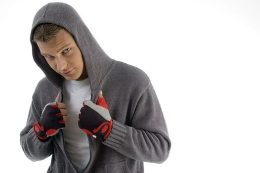 sportive man posing with hood jacket against white background