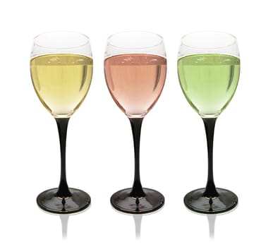 Multi-colored glasses of champagne or sparkling wine. On a white background, isolated.