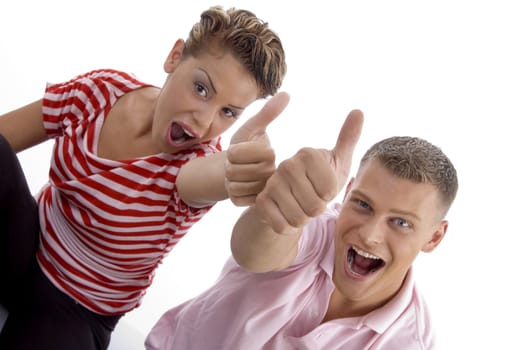 corner view of couple with thumbs up with white background