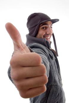 casual male model showing thumbs up on an isolated background