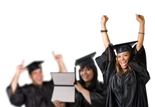 A group of high school or college graduates cheering happily on graduation day.