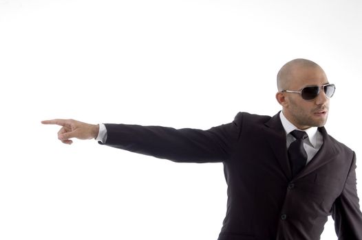 handsome young attorney pointing sideways on an isolated white background