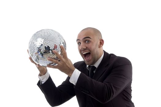 young accountant holding disco ball against white background