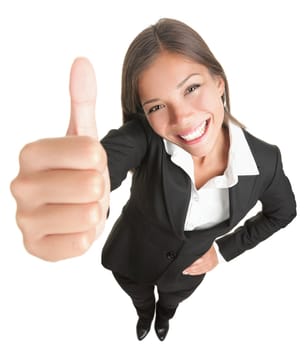 Success woman isolated giving thumbs up sign. Funny businesswoman in high and wide angle view. Mixed race Asian / Caucasian woman isolated on white background.
