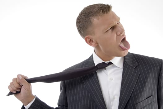 businessman tightening his tie on an isolated white background