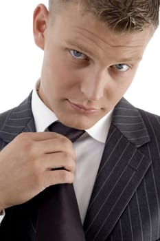 young professional wearing tie against white background