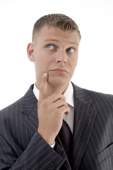 young thinking businessman looking upward on an isolated white background