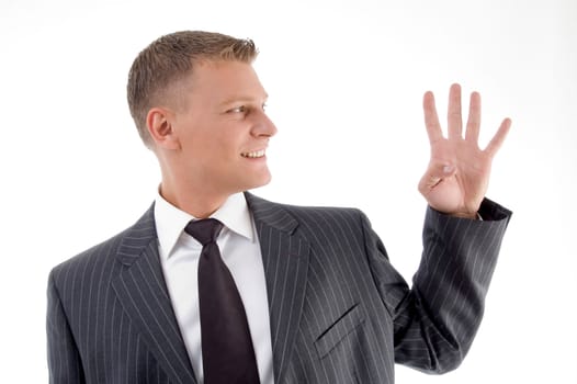 smiling businessman counting fingers on an isolated background