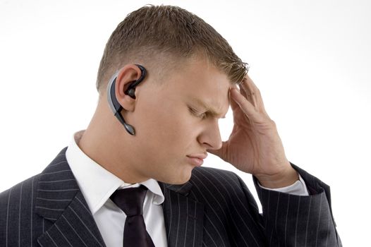 disturb businessman holding his head on an isolated background