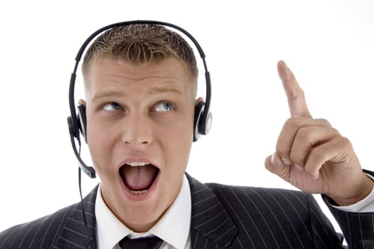 man surprised and pointing upwards with white background