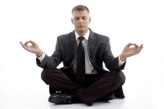 handsome young executive practicing yoga with white background