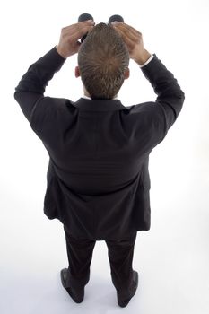 smart young lawyer viewing through binoculars on an isolated white background