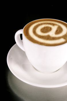 A cappucino with latte art at symbol