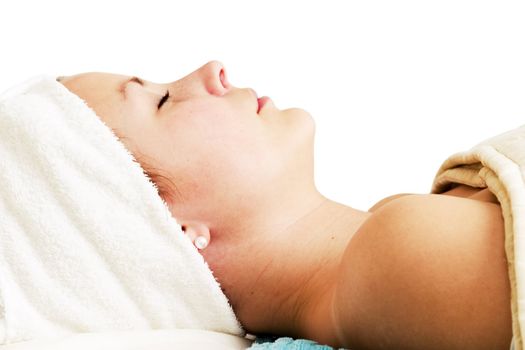 Relaxing during a facial treatment at a beauty spa.