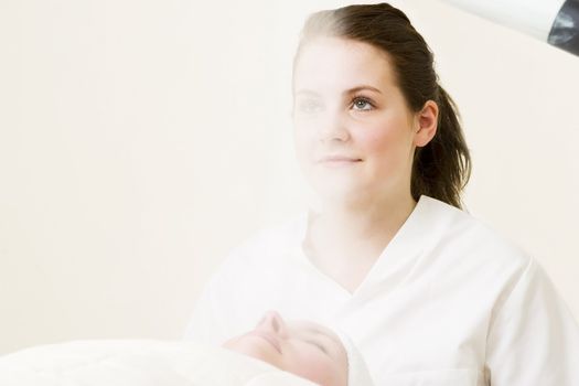 Steam treatment during a facial at a beauty spa.