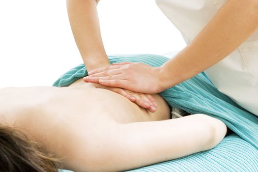 Massaging the lower back at a beauty spa.