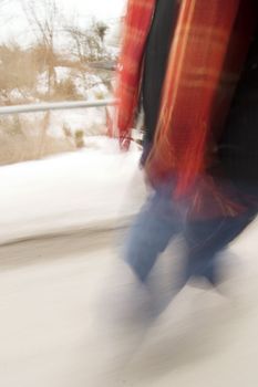 A motion blur abstract of a person walking in a hurry, a late rushing concept image.
