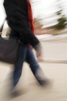 A motion blur abstract of a person walking in a hurry, a late rushing concept image.