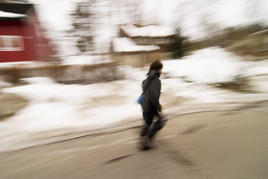 A motion blur abstract of a person walking in a hurry, a late rushing concept image.