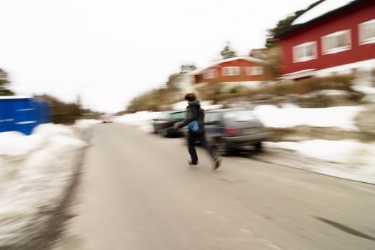 A motion blur abstract of a person walking in a hurry, a late or panic rushing concept image.