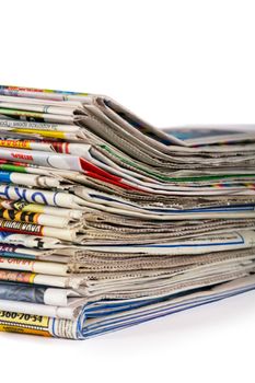 A pile of newspapers isolated on a white background