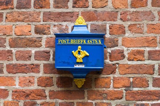 Retro Postbox on a Brick Wall in the Germany