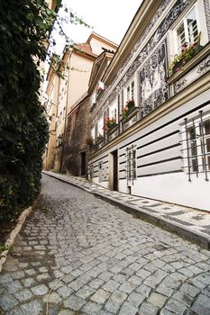 A small skinny street detail in the old town area of Prague, Czech Republic.