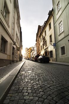A small skinny street detail in the old town area of Prague, Czech Republic.