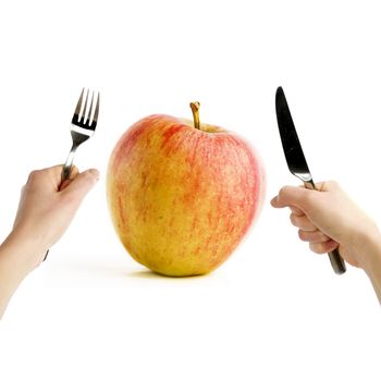 A pair of hands ready to eat a healthy apple.  Healthy eating concept image.