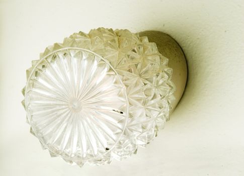A retro wall lamp in an old bathroom