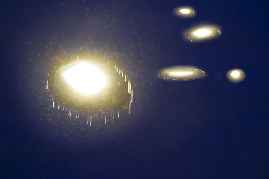 A night sky filled with ufos, abstract motion blur image.