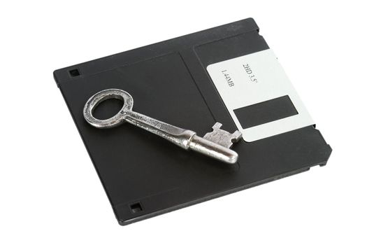 A skeleton key and a 3 1/2" computer disk, isolated on white with clipping path.