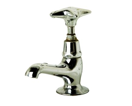 A retro bathroom sink tap isolated on white with clipping path.