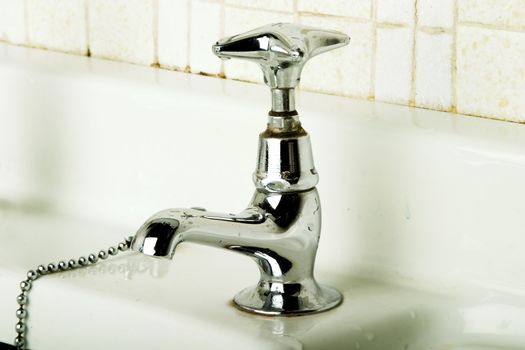 A retro bathroom sink tap.