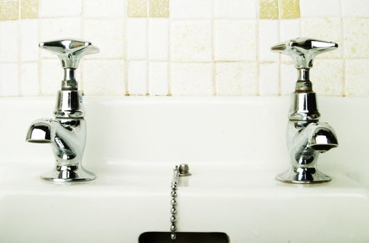 A retro bathroom sink tap.