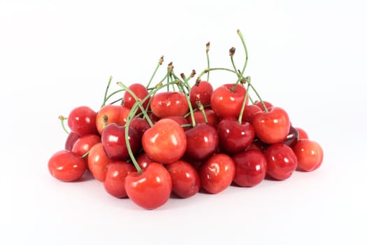 Heap of sweet cherries isolated on white