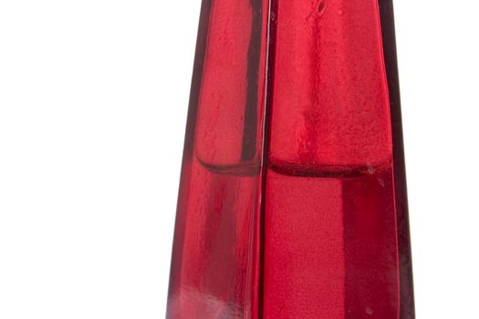 A red glass bottle isolated on white with clipping path.