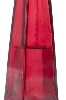 A red glass bottle isolated on white with clipping path.