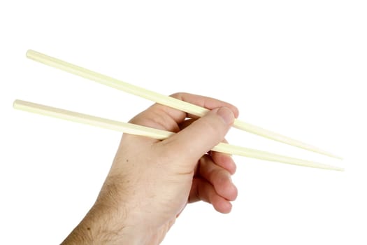 A males hand using chopsticks, isolated on white with clipping path.
