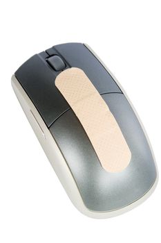 A cordless mouse with a adhesive bandage on it.  Isolated on white withclipping path.