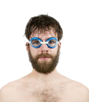 A humorous male with a bear and swimming goggles looking into the camera.  Fresh thinking concept image.