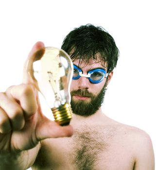 A funny looking male with a bear and swimming goggles, holding a clear light. Concept image for fresh thinking, new ideas.