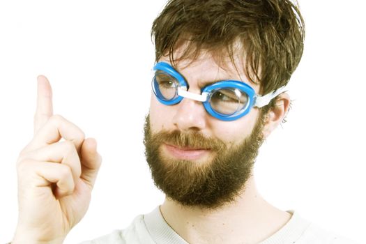 A funny looking young male with a beard, thinking of a good idea.