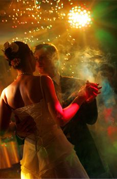 Newlywed couple dancing at their wedding reception.