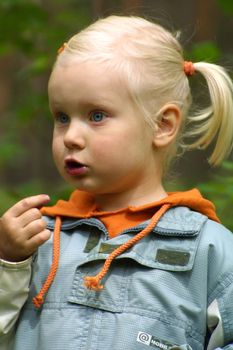 little girl it berries in the forest